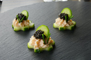 Cucumber rounds with smoked salmon mousse and caviar
