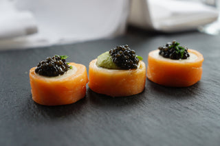Salmon rolls with salmon mousse, avocado mousse and caviar
